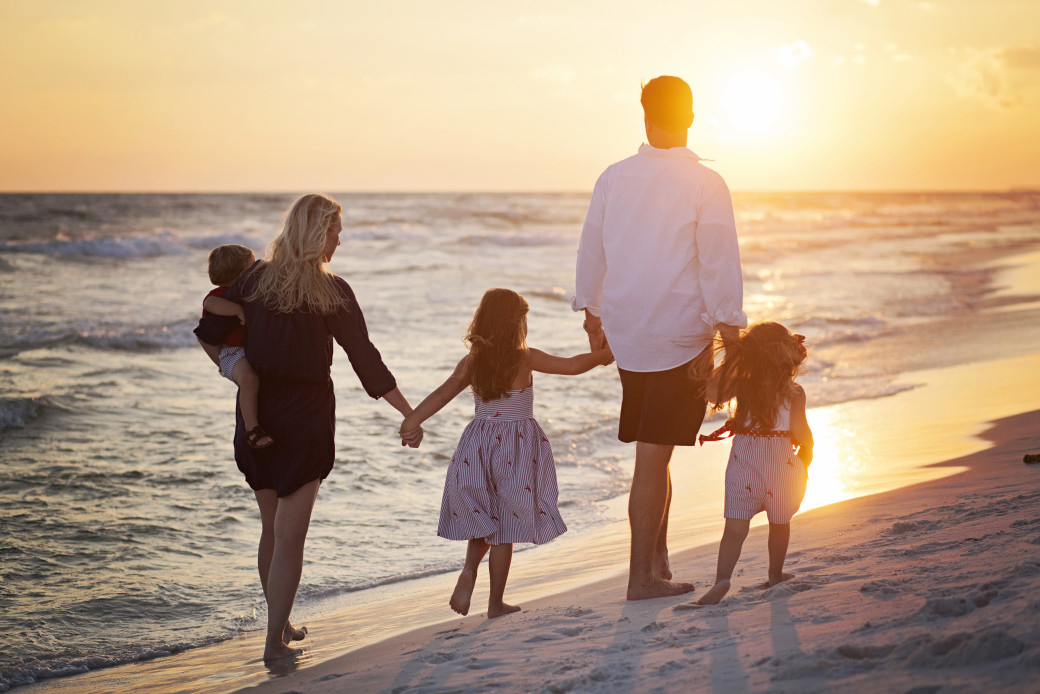 Family walking on beach