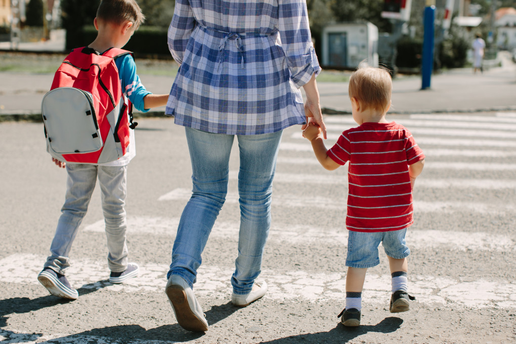 Children and adult crossing the street