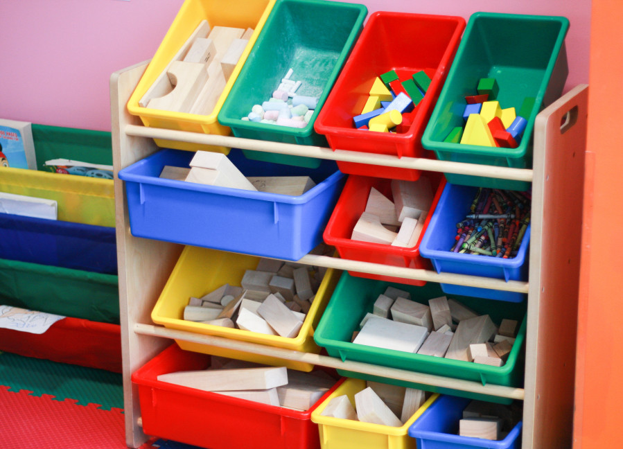 Toddler toys organized on a shelf