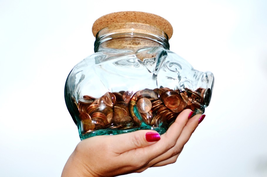 Woman holding a piggy bank