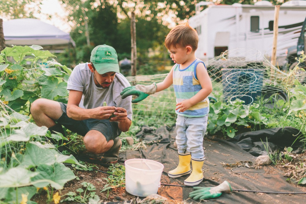 Child helping adult in the garden