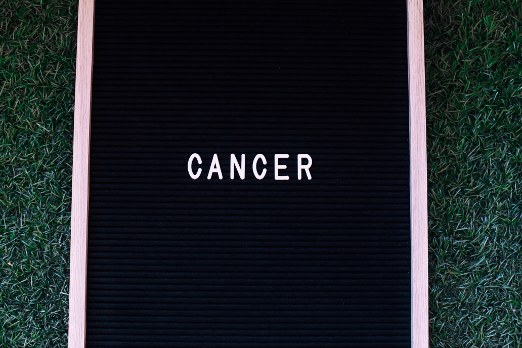 Board that says cancer