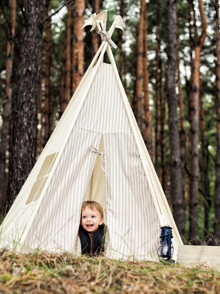 Child playing in tent