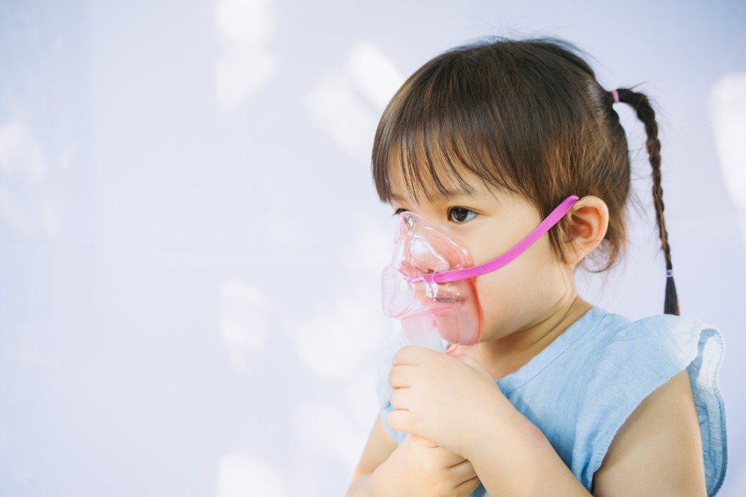 Child using nebulizer