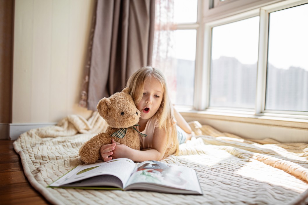 Child reading in bed