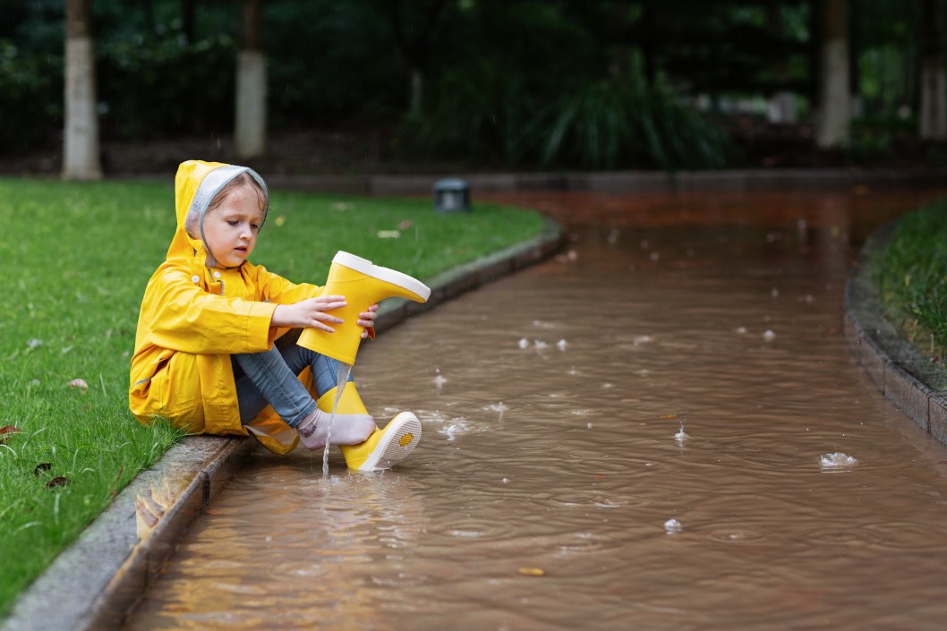 Kid playing in rain