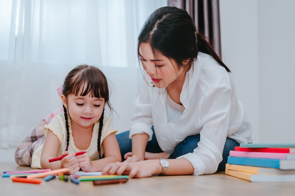 Teacher with preschooler reading