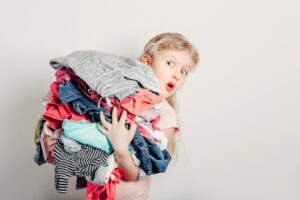 Kid holding clothes
