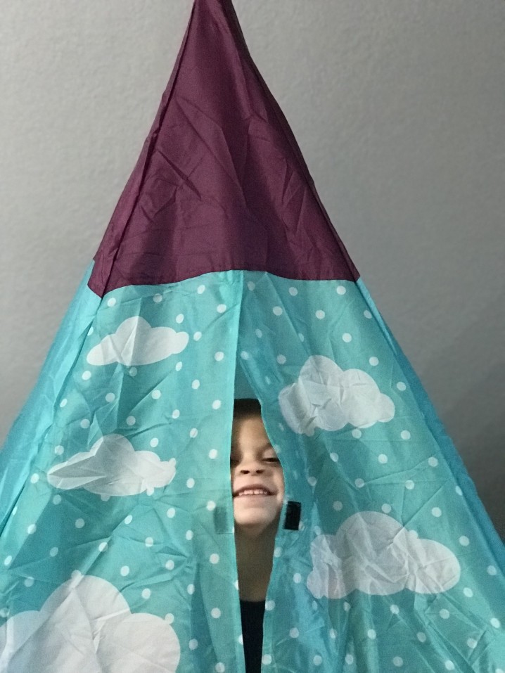 Kid playing in tent