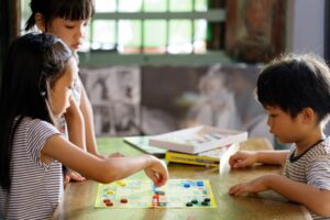 Kids playing board game