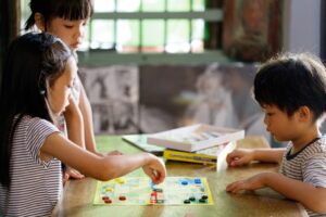 Kids playing board game