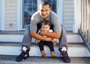 Dad hugging toddler son