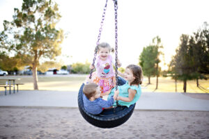 Kids on tire swing