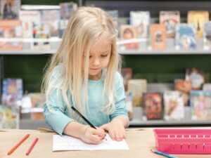 Small girl at daycare drawing