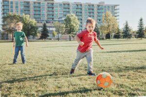 Kid kicking soccer ball