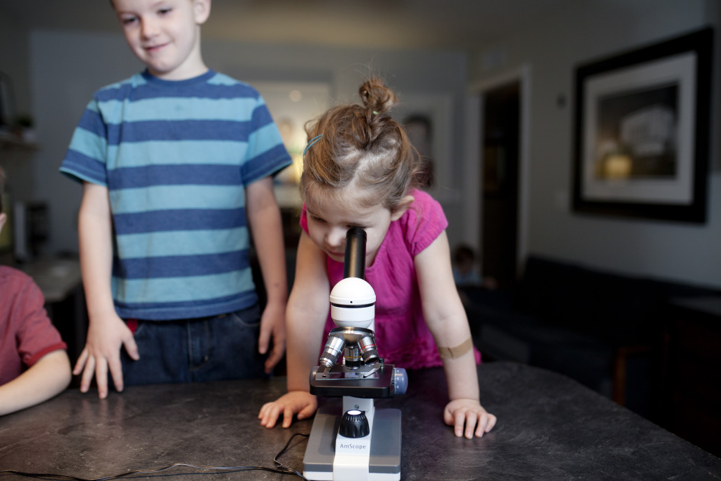 Child looking in microscope
