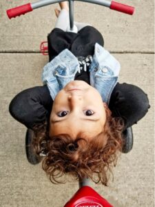 toddler on tricycle