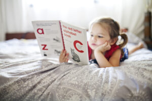 Little girl reading a book