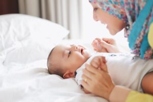 Woman talking to baby