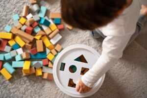 Toddler playing with blocks