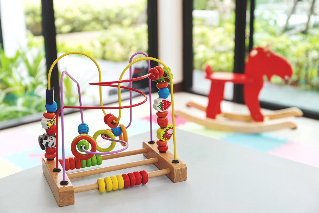 children's bead maze and rocking horse at daycare location