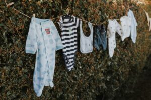 Baby clothes on a laundry line.