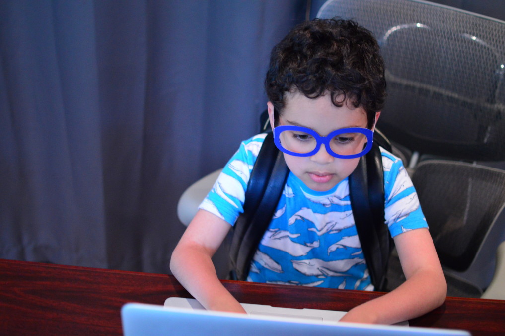 Child at a computer for at home learning.