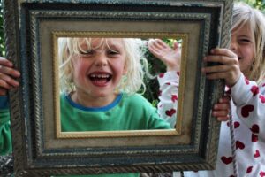Kid chooses a picture frame for mothers day.