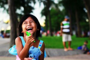 Child playing with a kite during a break on a road trip.