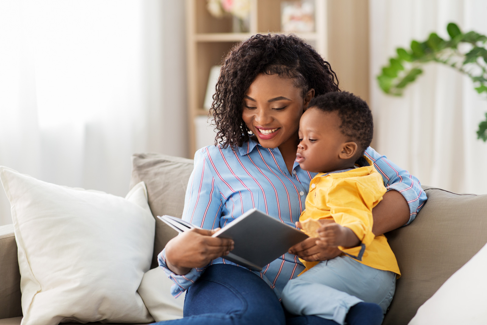 A Mom reads to her toddler to encourage speech development