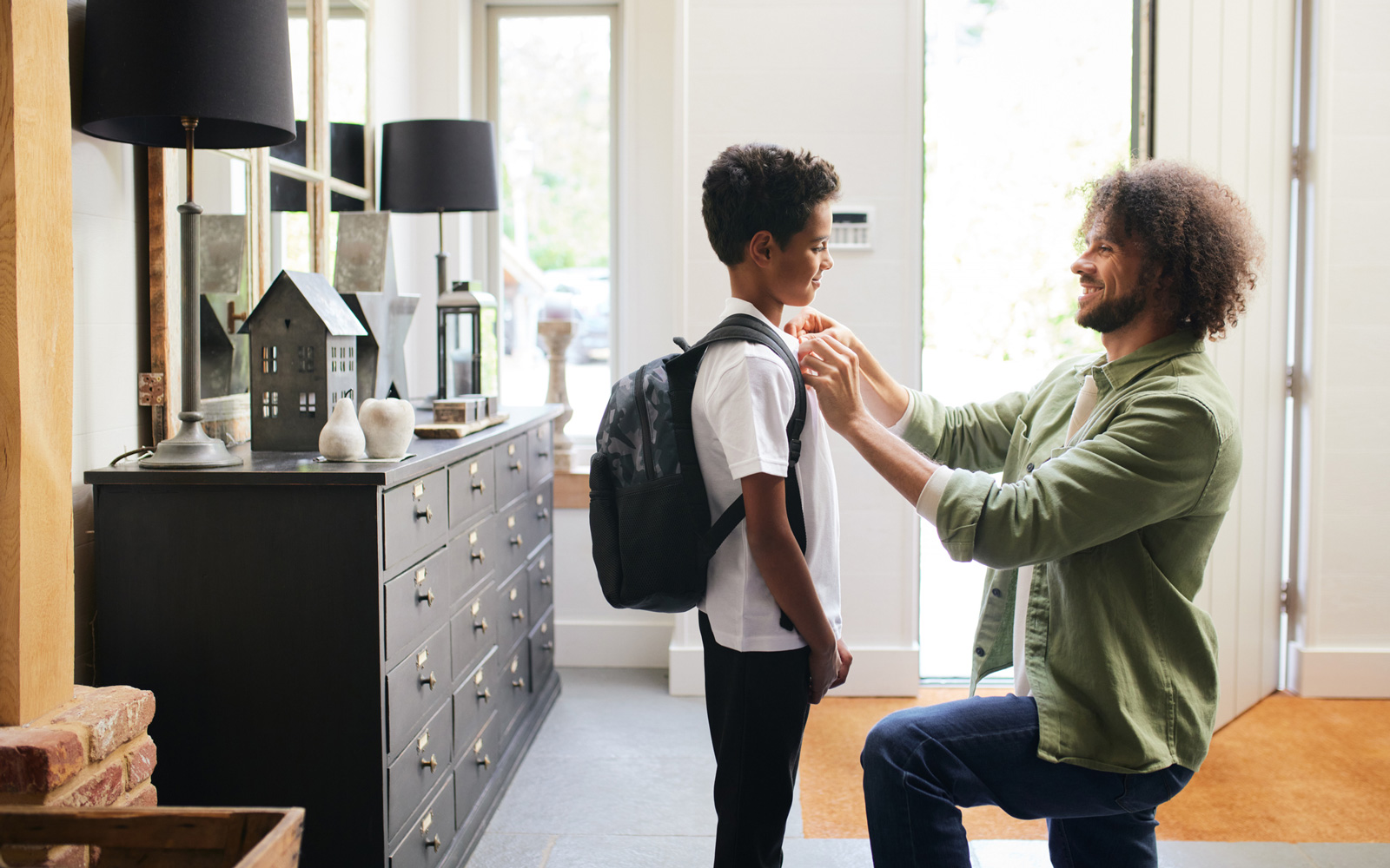 Dad getting son ready for school in the morning