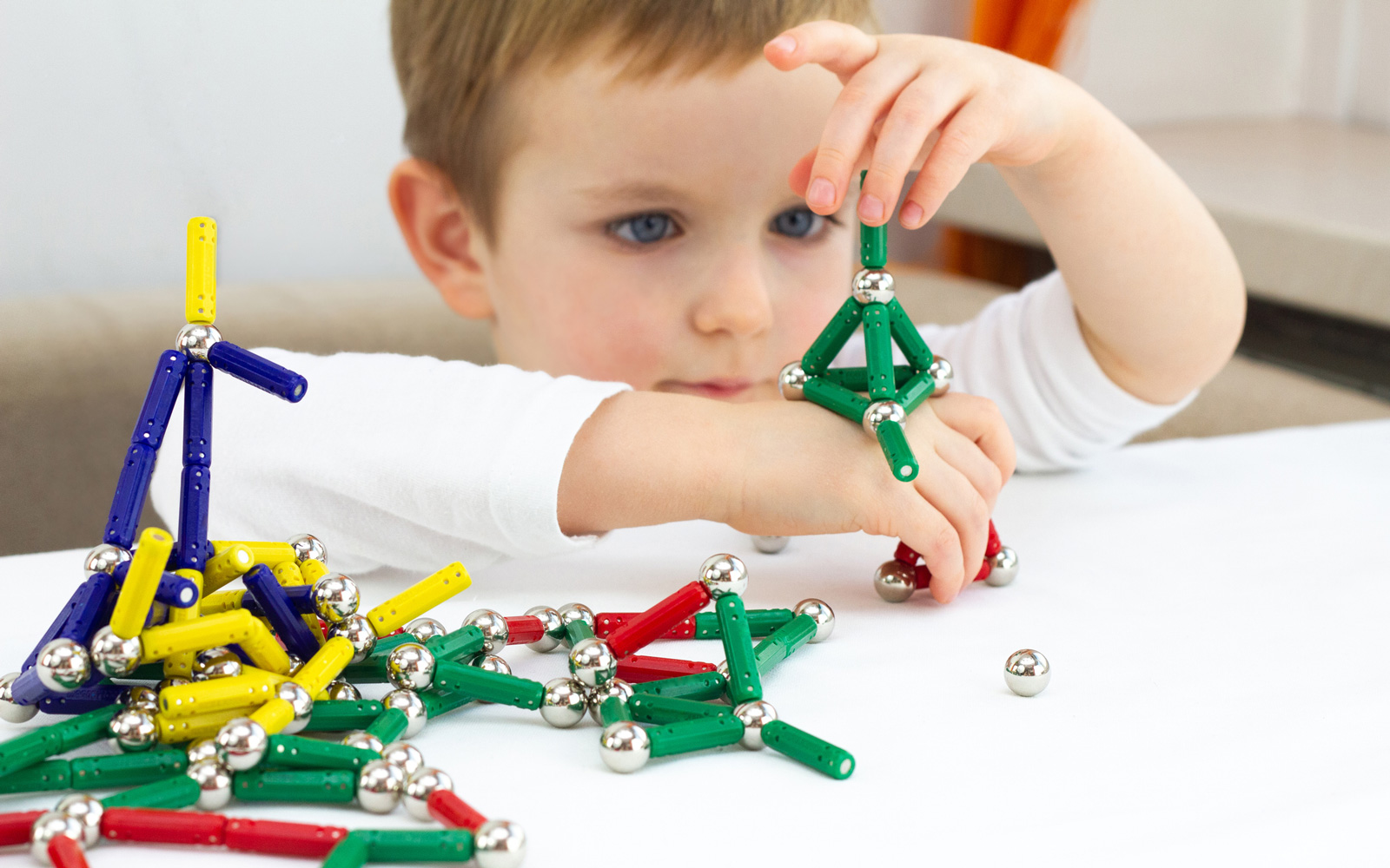 Child playing with magnet toys