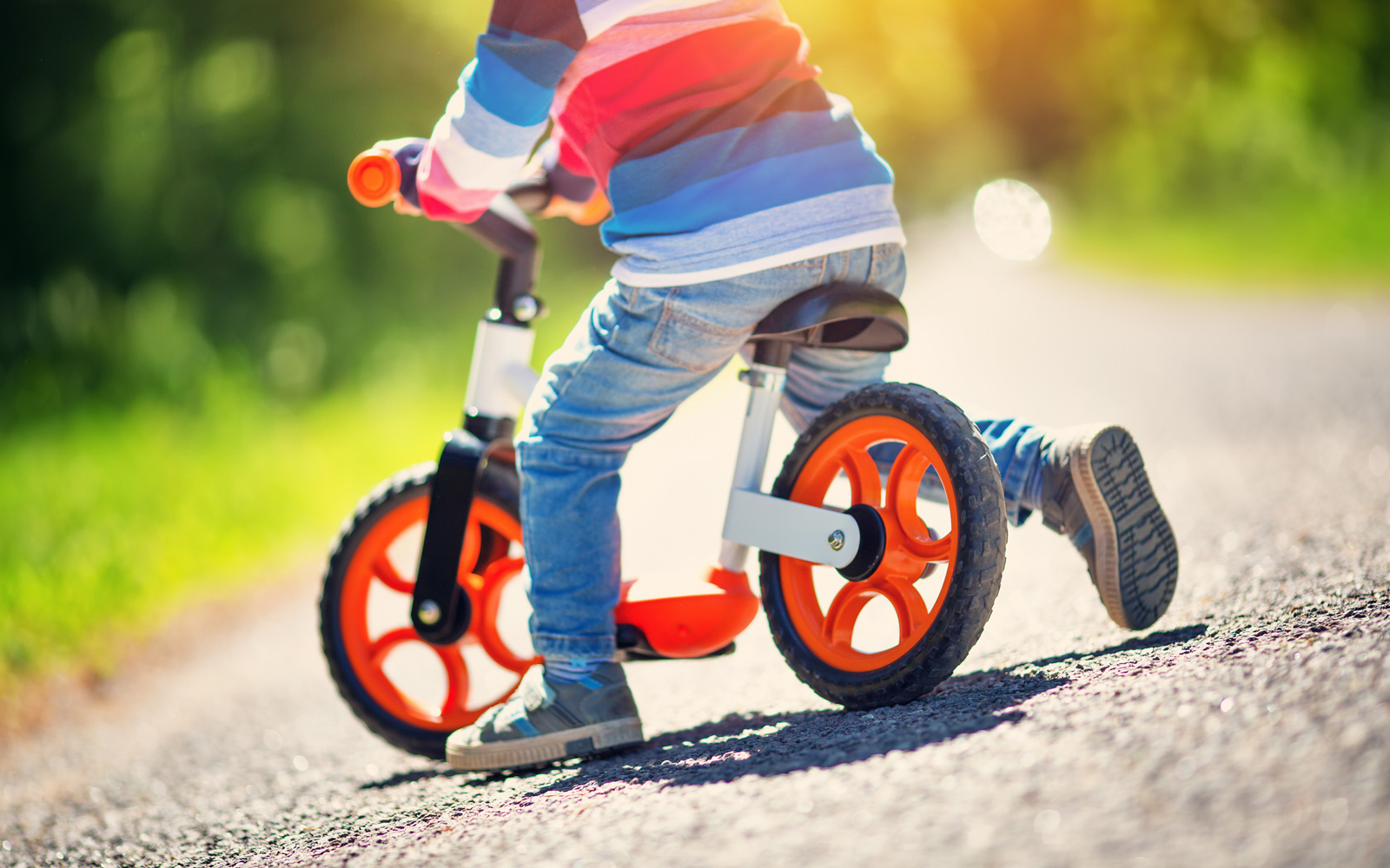 Child using a balance bike