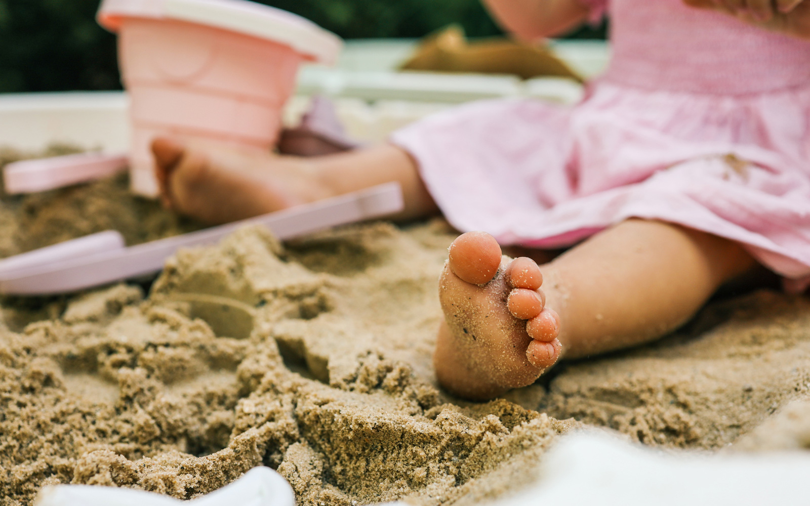 Baby sitting in a sandbox