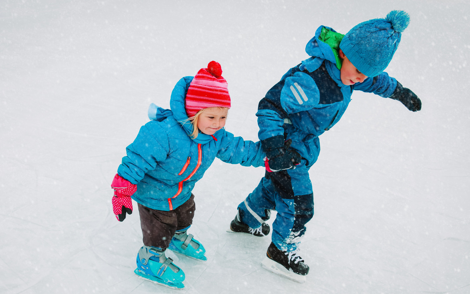 Two children ice skating