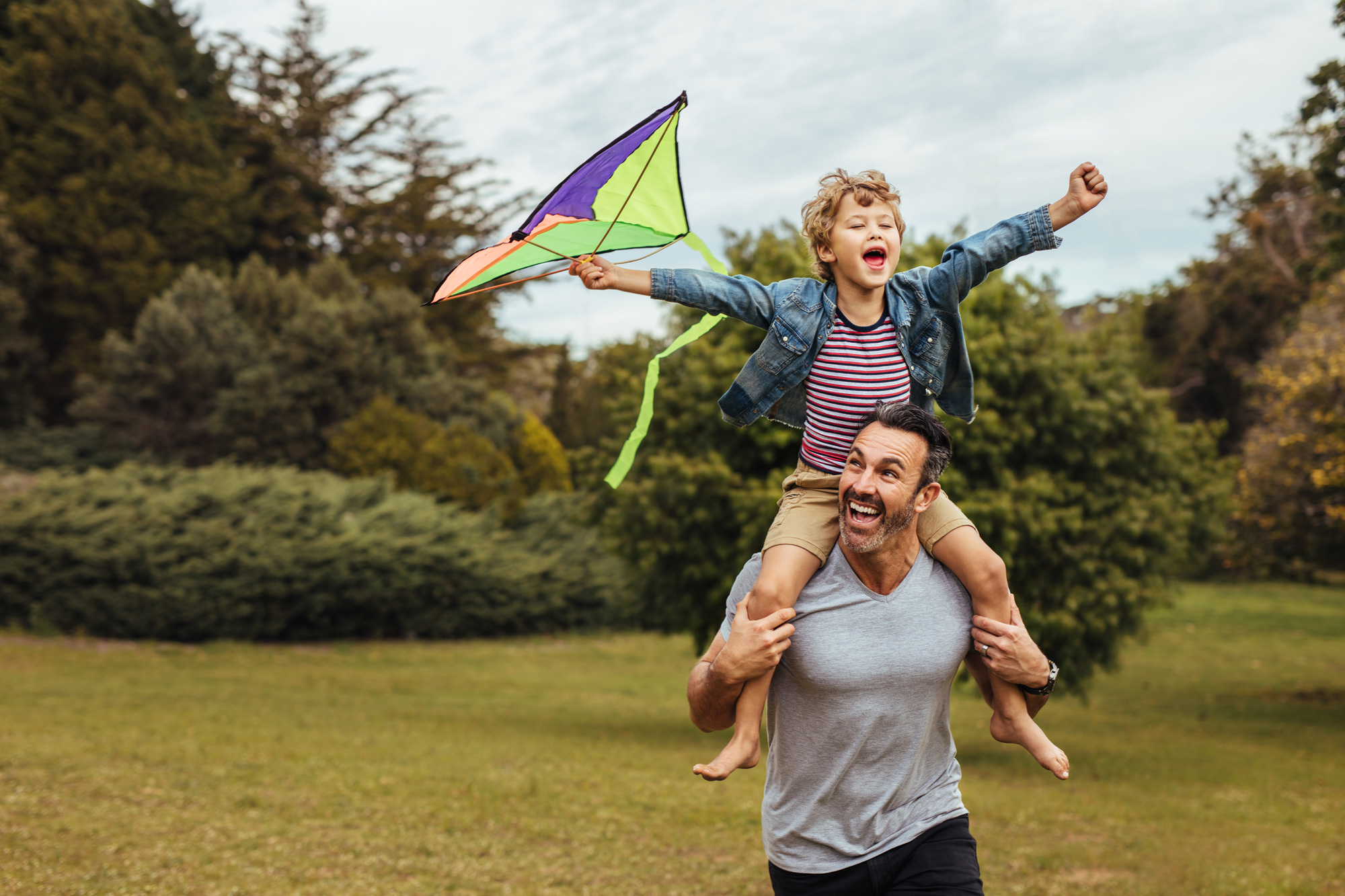 Father and son flying a kite