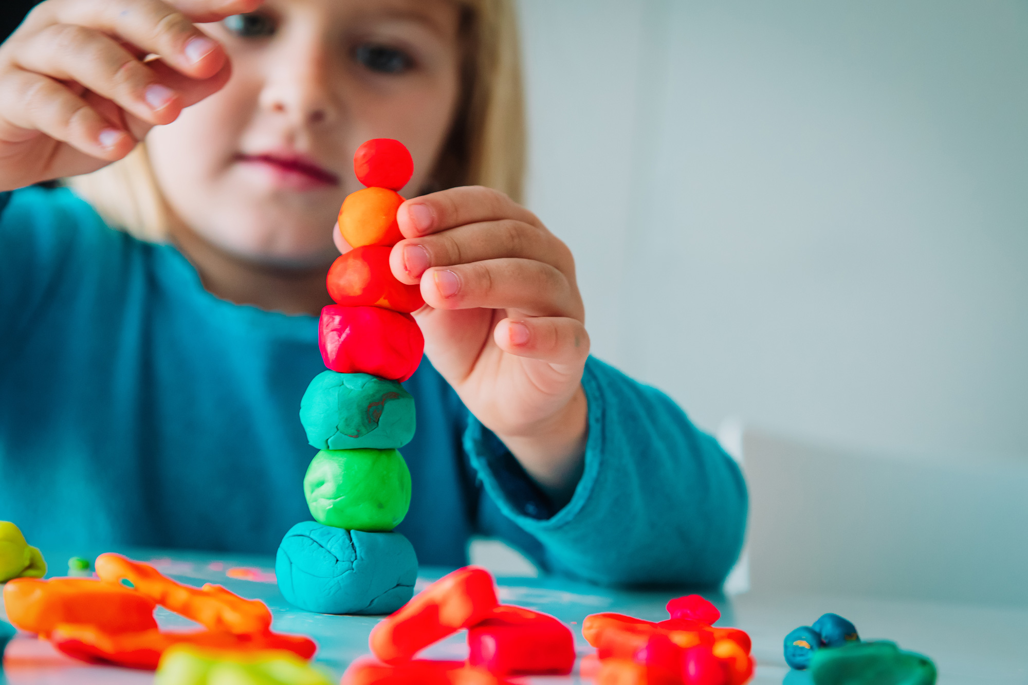 Toddler playing with playdough