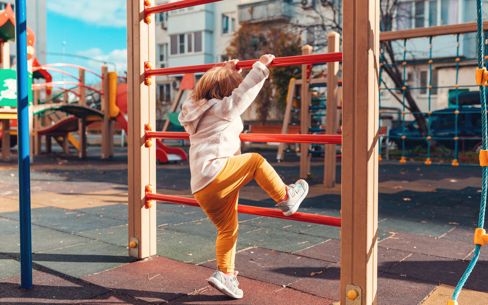 Child Climbs on Playground