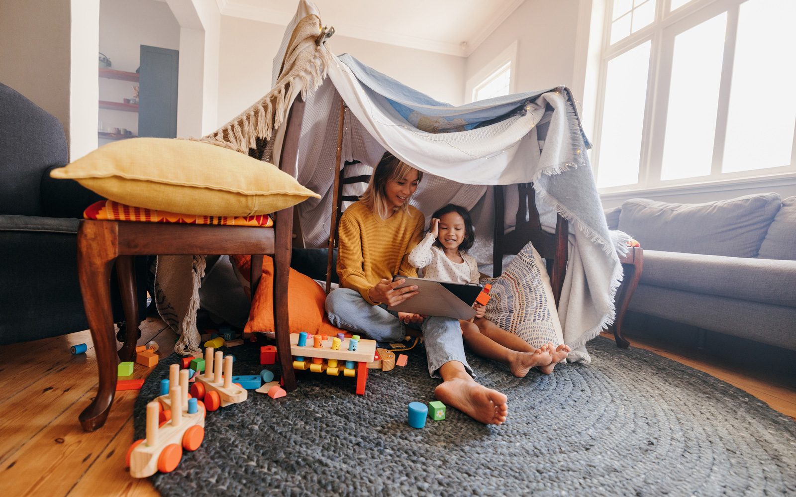 Mother and Daughter Play in a Fort