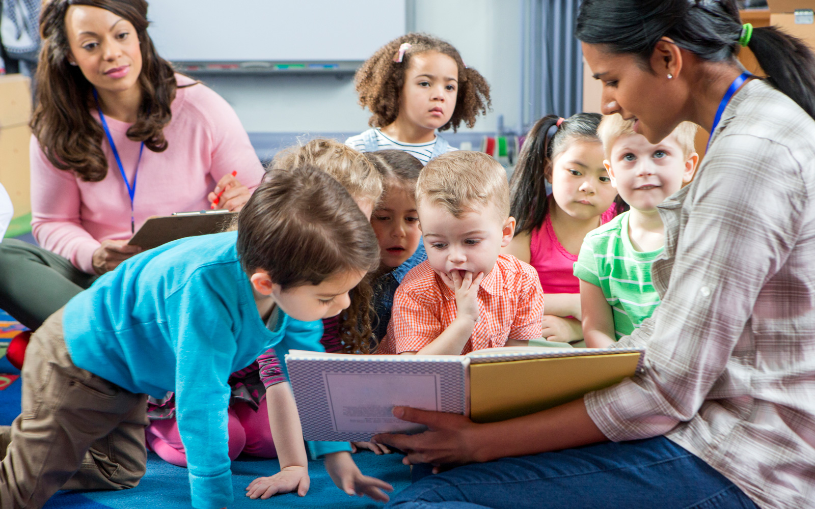Woman Reads to Kids in Preschool Class