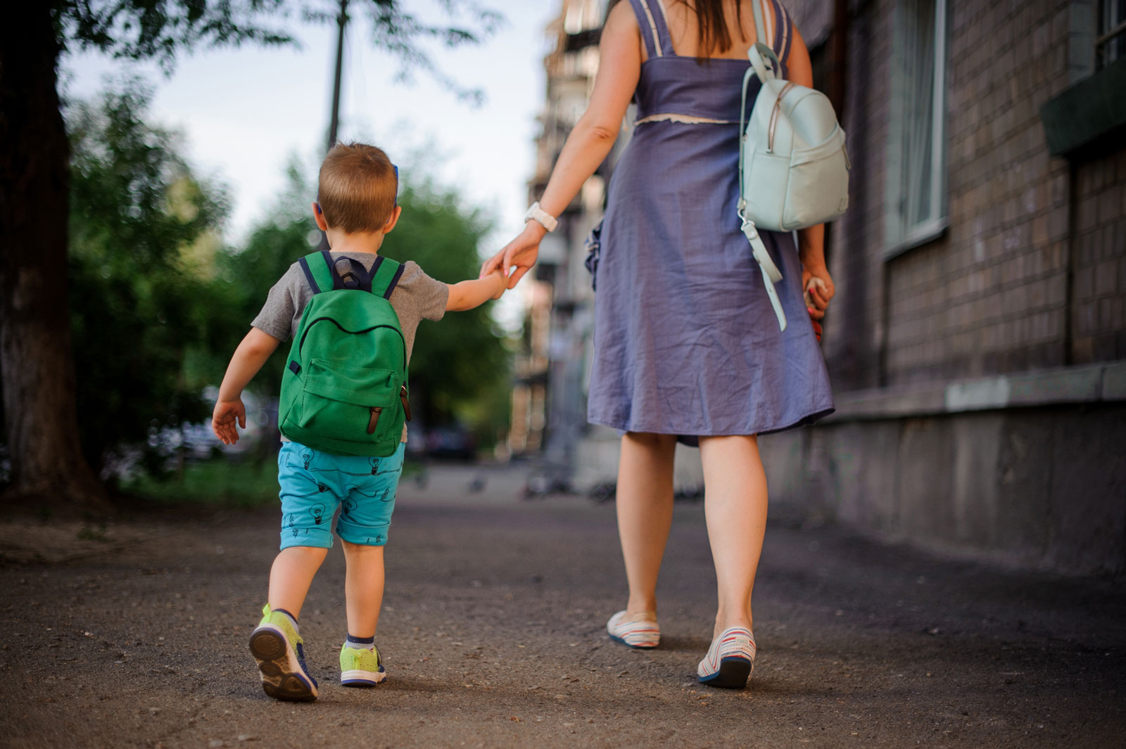 Mom and son walk to childcare