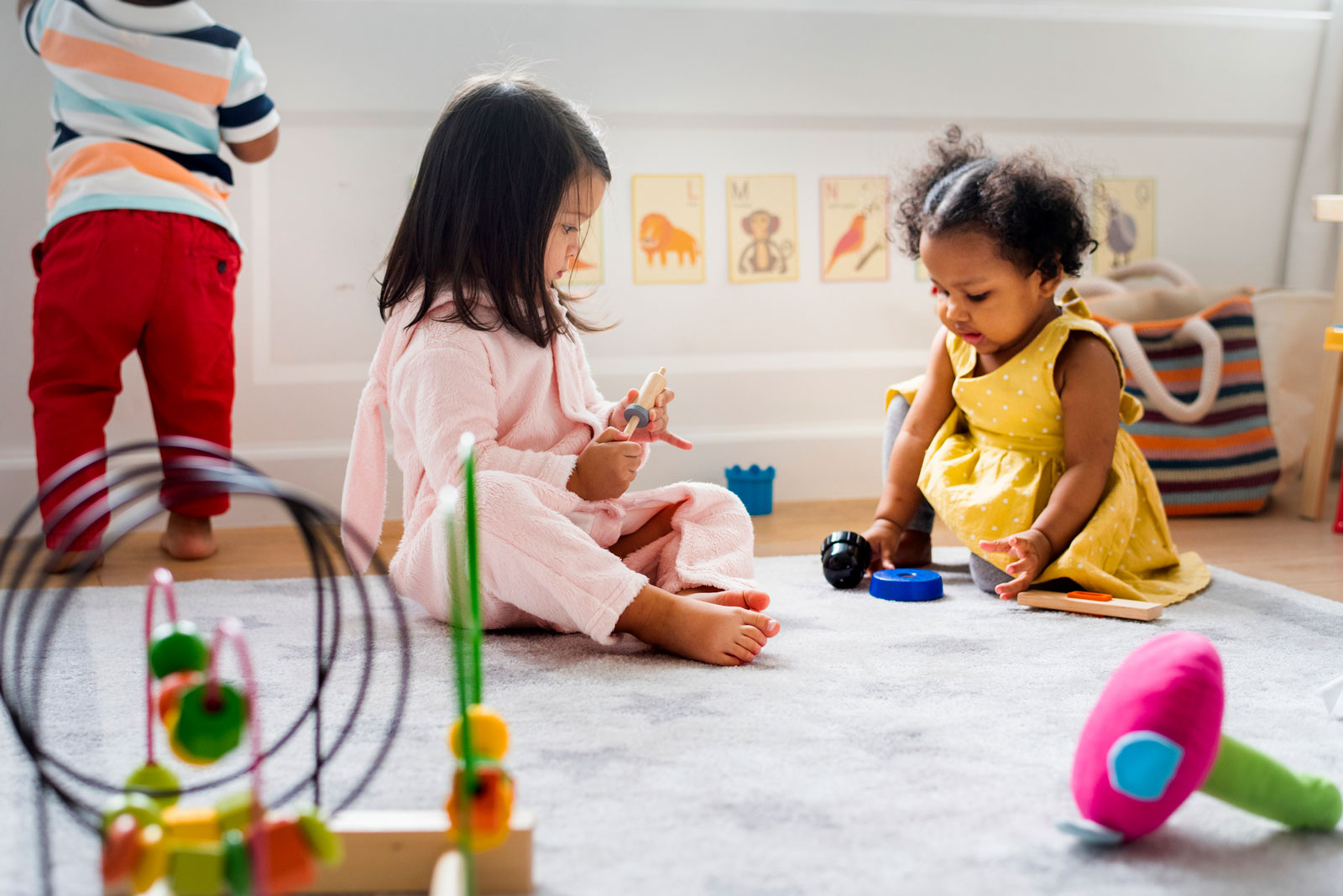 Toddlers playing in daycare classroom
